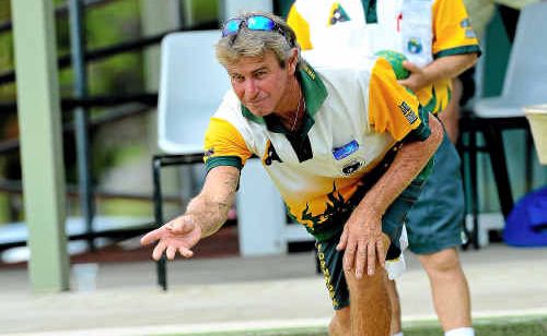 Tony Wills delivers as Stuart Hartigan watches on during the District Fours finals at Coffs Ex-Services. Tony Wills delivers as Stuart Hartigan watches on during the District Fours finals at Coffs Ex-Services.